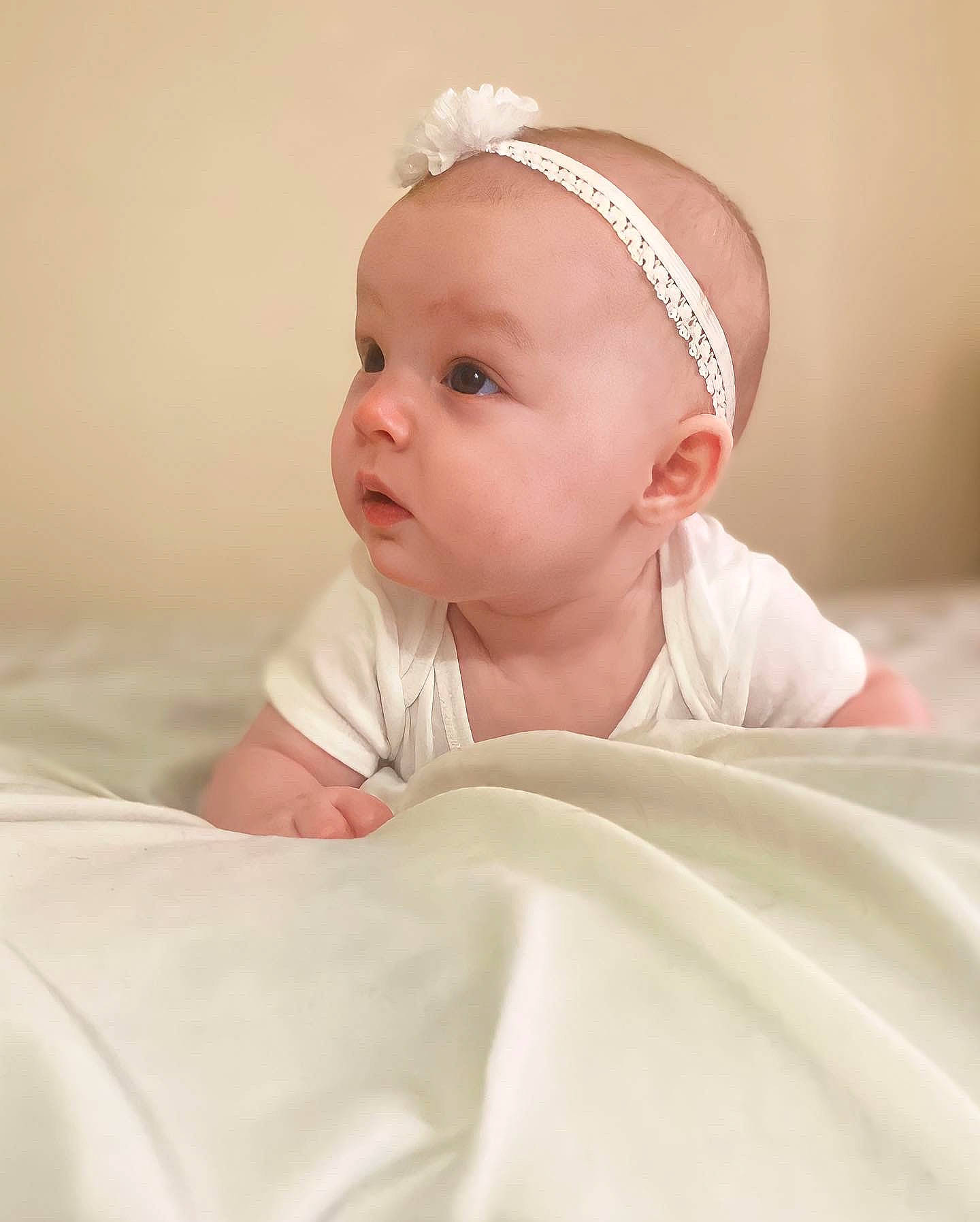 Alora is registered to the contest to win money with this photo: baby, baby_sleeping, baby_toddler_clothing, cheek, child, chin, comfort, eyebrow, eyelash, fashion_accessory, happy, headband, headgear, linens, lip, person, portrait_photography, room, skin, sleeve
