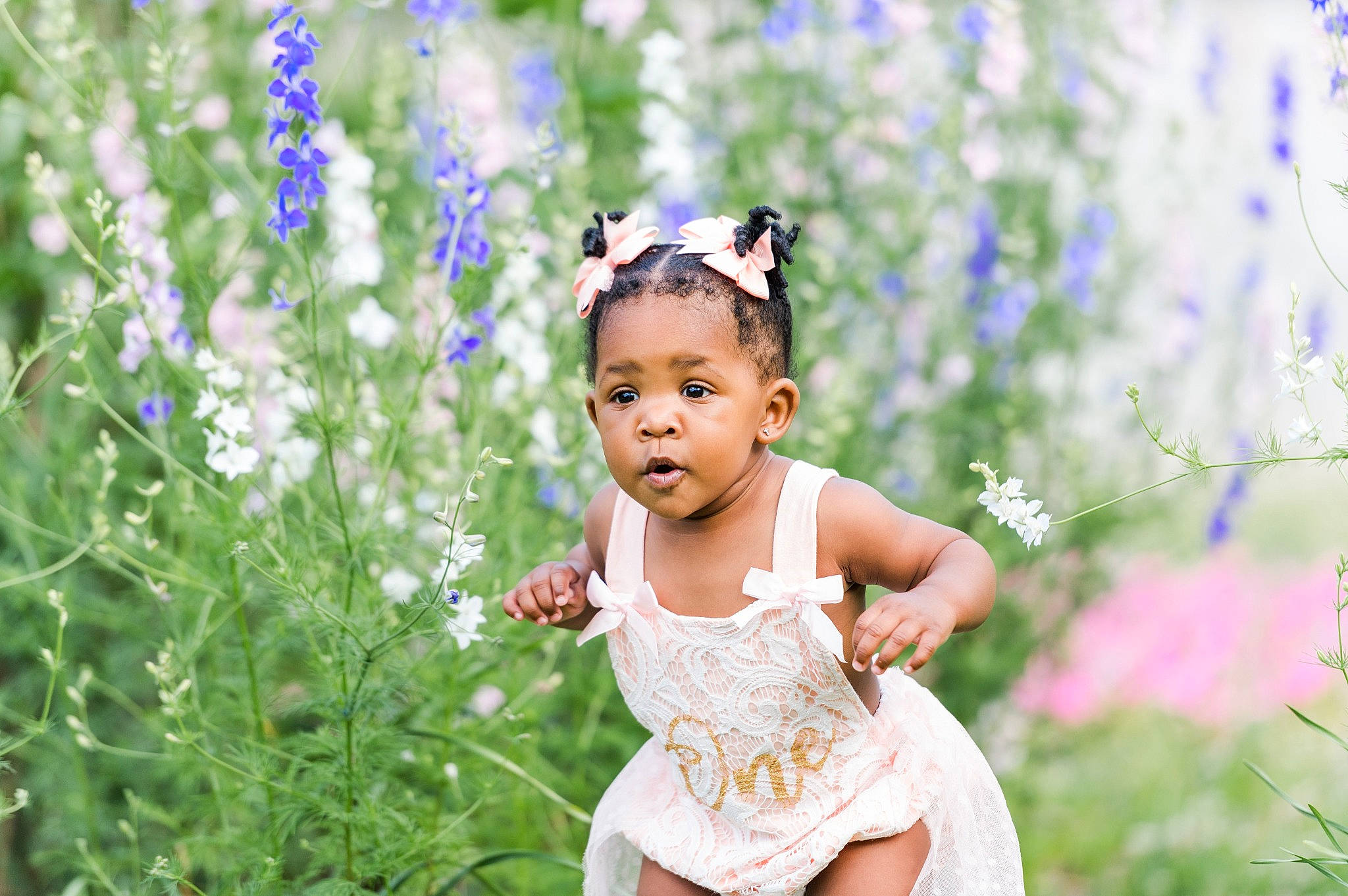 Anastasia is registered to the contest to win money with this photo: baby, baby_toddler_clothing, child, flash_photography, flower, flowering_plant, grass, grass_family, grassland, happy, headpiece, herbaceous_plant, meadow, people_in_nature, person, petal, plant, smile, spring, summer