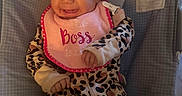 Naomi joined the competition — help win amazing prizes! baby, smiling, infant, bib, leopard_print, onesie, baby_seat, rainbow, monkey, colorful, happy, cute, child, indoors, face, clothing, portrait, seat, cheerful, joy