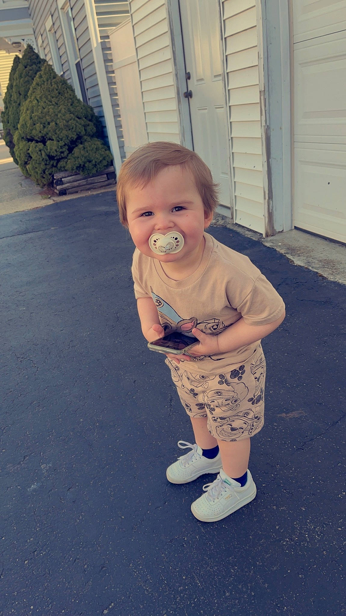 Kayden is registered to the contest to win money with this photo: asphalt, baby, baby_toddler_clothing, child, door, eye, flooring, fun, grass, happy, human_leg, pattern, person, plant, road_surface, sandal, sidewalk, standing, t_shirt, toddler