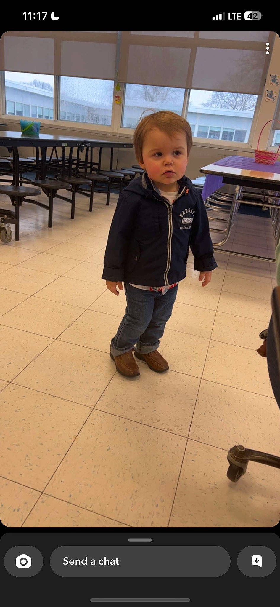 Kayden is registered to the contest to win money with this photo: baby_toddler_clothing, bench, chair, child, floor, flooring, fun, hardwood, leisure, person, play, room, sandal, shoe, sitting, sleeve, table, toddler, vacation, wood