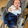 baby, baby_rocker, blue_pants, child, cozy, cute, furniture, gray_fabric, happy, home, indoor, infant, person, portrait, seat, smiling, socks, tile_floor, white_shirt, young_child