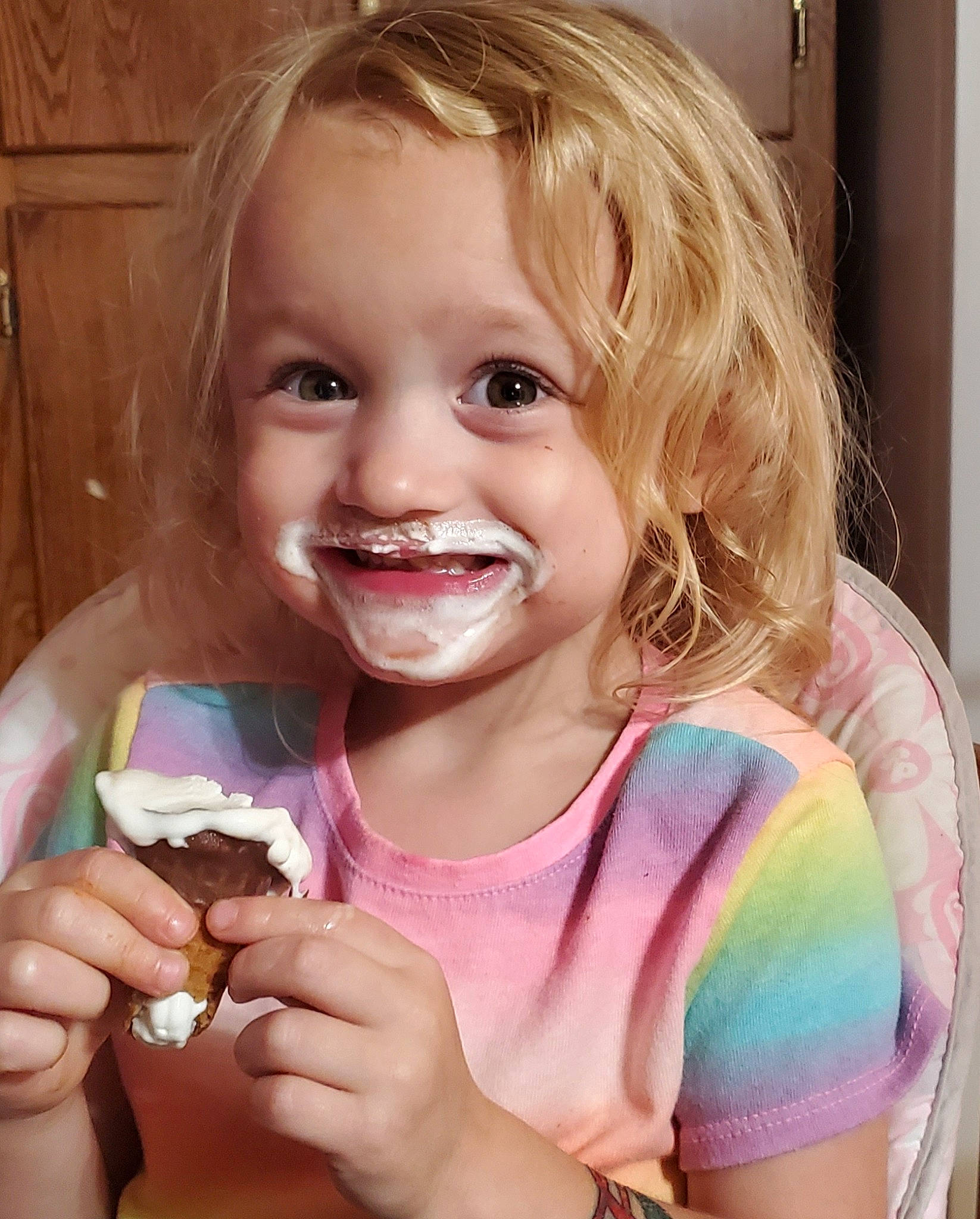 Adaline is registered to the contest to win money with this photo: child, dairy, dessert, eating, food, food_craving, frozen_dessert, ice_cream, joy, person, smile, sweetness, toddler