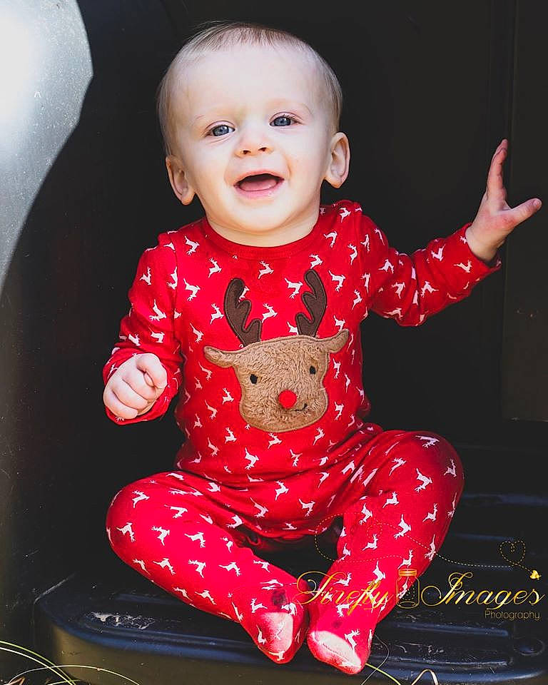 Cason is registered to the contest to win money with this photo: baby, baby_toddler_clothing, child, child_model, design, face, head, lip, pajamas, pattern, person, photography, pink, portrait_photography, product, red, sitting, skin, sleeve, toddler