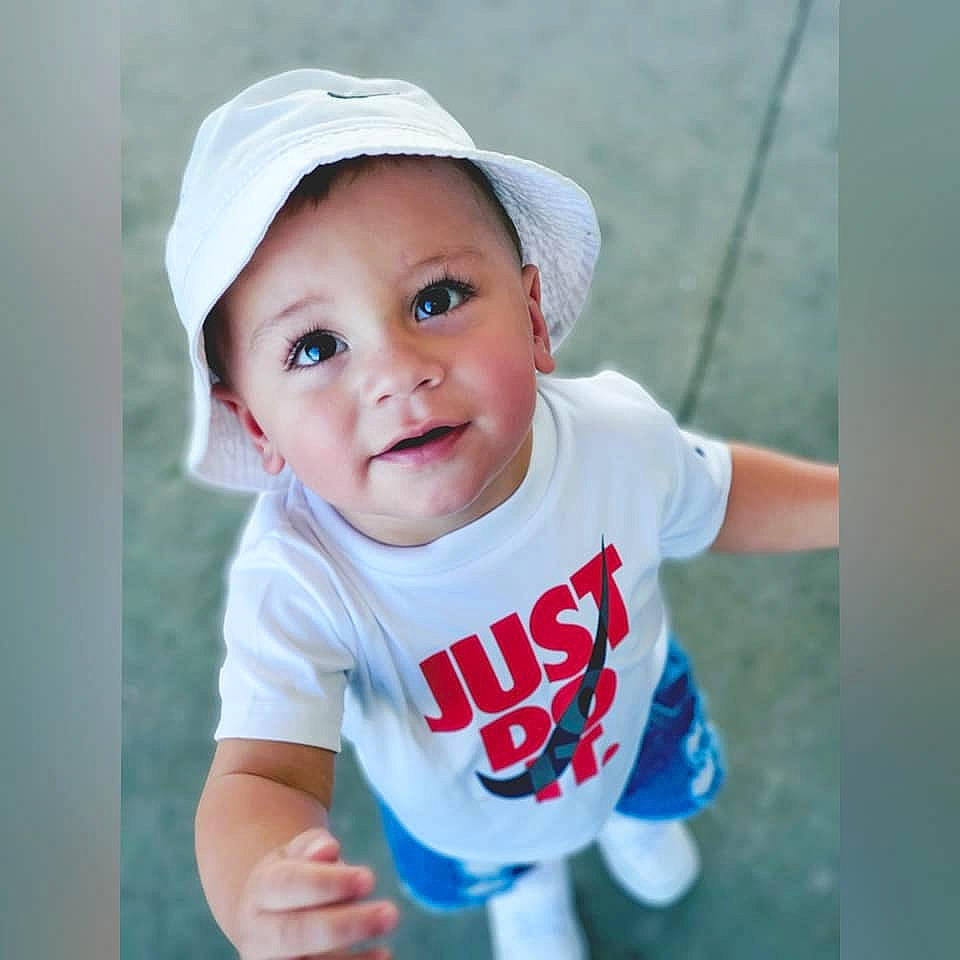 Liam joined the competition — help win amazing prizes! azure, baby, baby_toddler_clothing, baseball_cap, cap, electric_blue, eye, fun, gesture, grass, happy, hat, headwear, lip, people_in_nature, person, recreation, sleeve, smile, swing