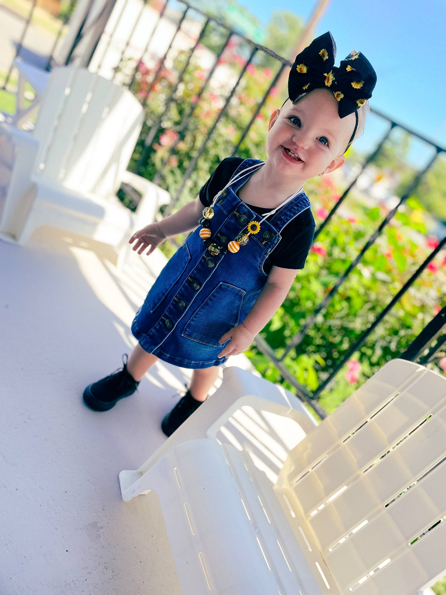 Finley joined the competition — help win amazing prizes! child, city, denim, electric_blue, fence, fun, grass, happy, hat, headwear, joy, leisure, pattern, person, recreation, sandal, sitting, sky, street_fashion, t_shirt