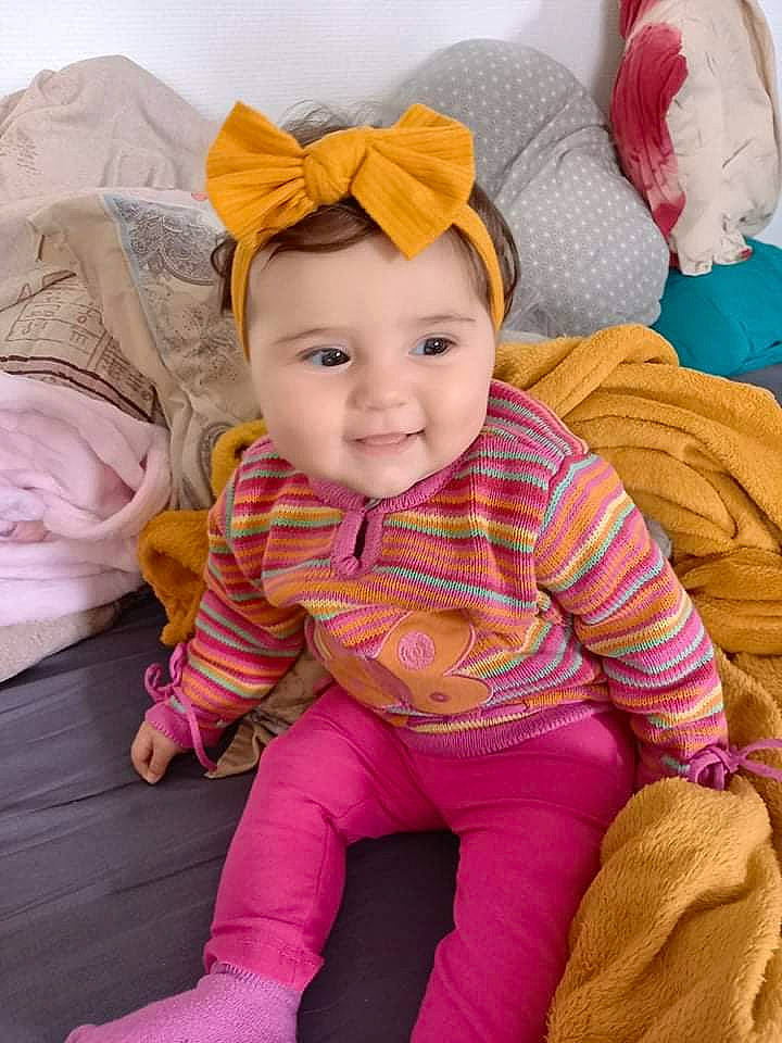 Nélia a rejoint le concours — aidez-le/la à gagner de superbes lots ! baby, baby_toddler_clothing, cheek, comfort, cool, eye, happy, head, headgear, headwear, joy, lip, nose, outerwear, person, pink, product, skin, sleeve, smile