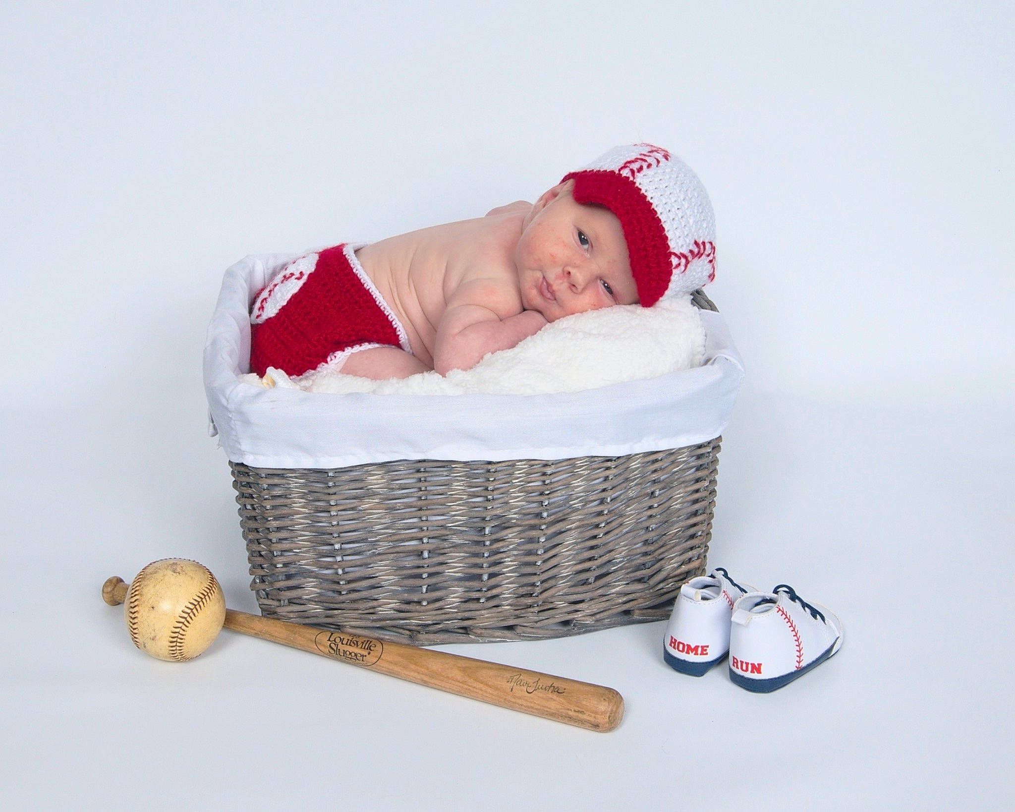 Oliver Jude is registered to the contest to win money with this photo: baby, baby_products, baby_safety, baby_sleeping, baby_toddler_clothing, basket, carmine, child, comfort, costume_hat, event, fashion_accessory, headwear, holiday, person, picnic_basket, room, sitting, storage_basket, toddler