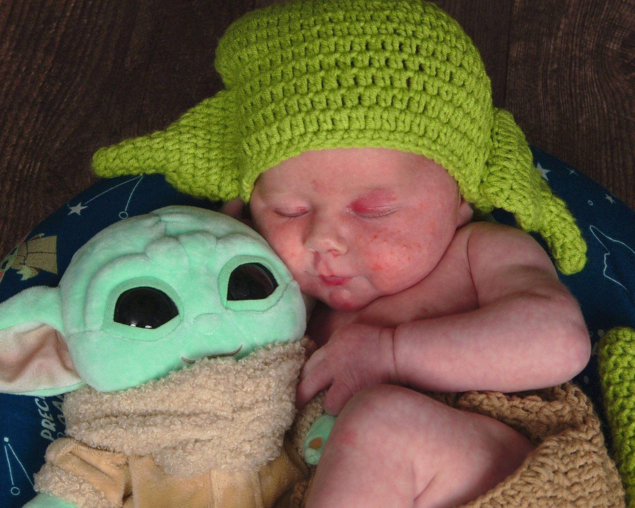 Oliver Jude is registered to the contest to win money with this photo: baby, baby_sleeping, baby_toddler_clothing, cap, cheek, comfort, eye, grass, green, hat, head, headgear, headwear, knit_cap, linens, mouth, nose, person, skin, thumb