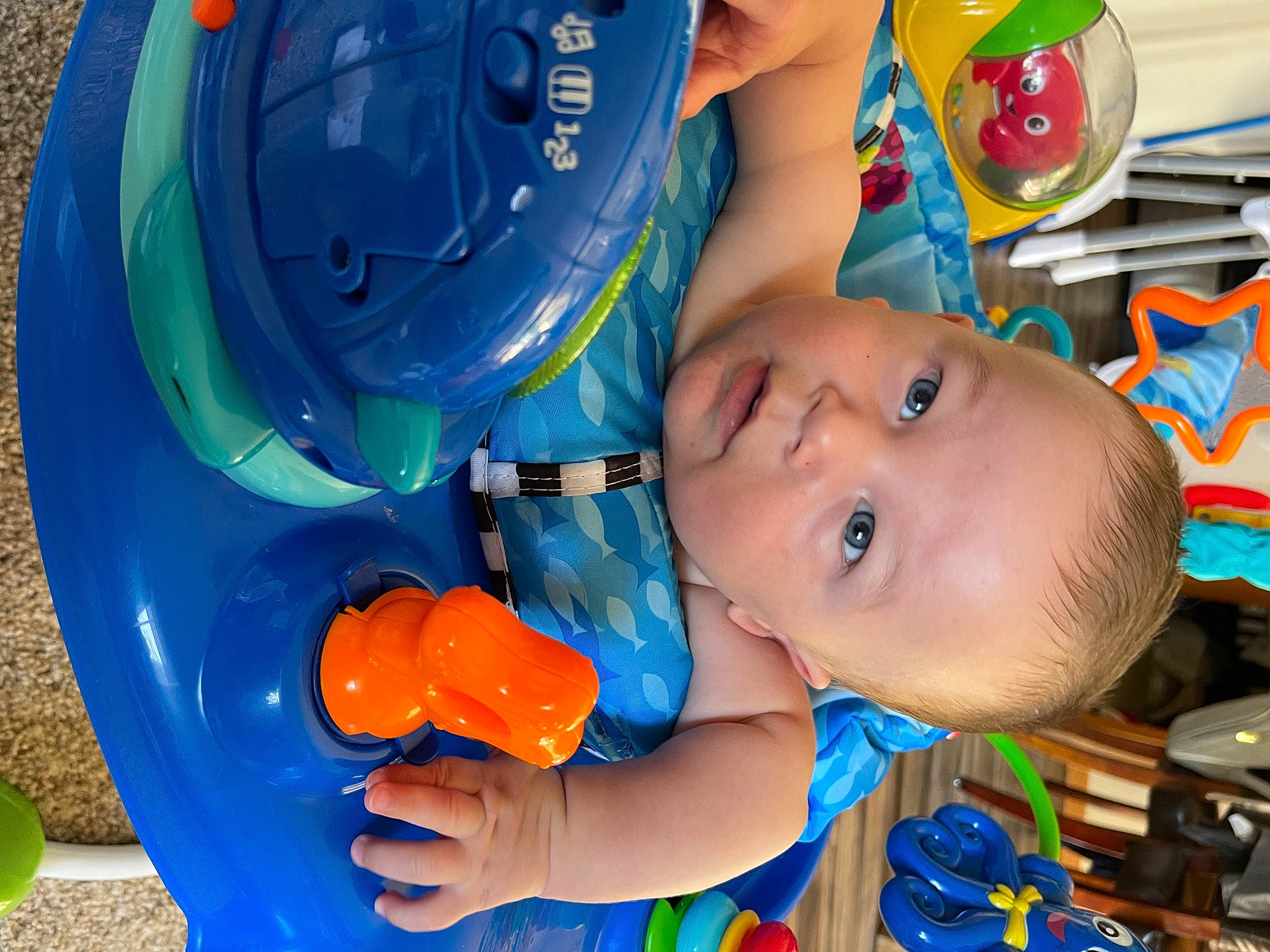 Colton is registered to the contest to win money with this photo: baby, baby_playing_with_toys, baby_products, baby_toddler_clothing, blue, child, electric_blue, facial_expression, fun, happy, leisure, party_supply, person, plastic, play, product, recreation, toddler, toy, water