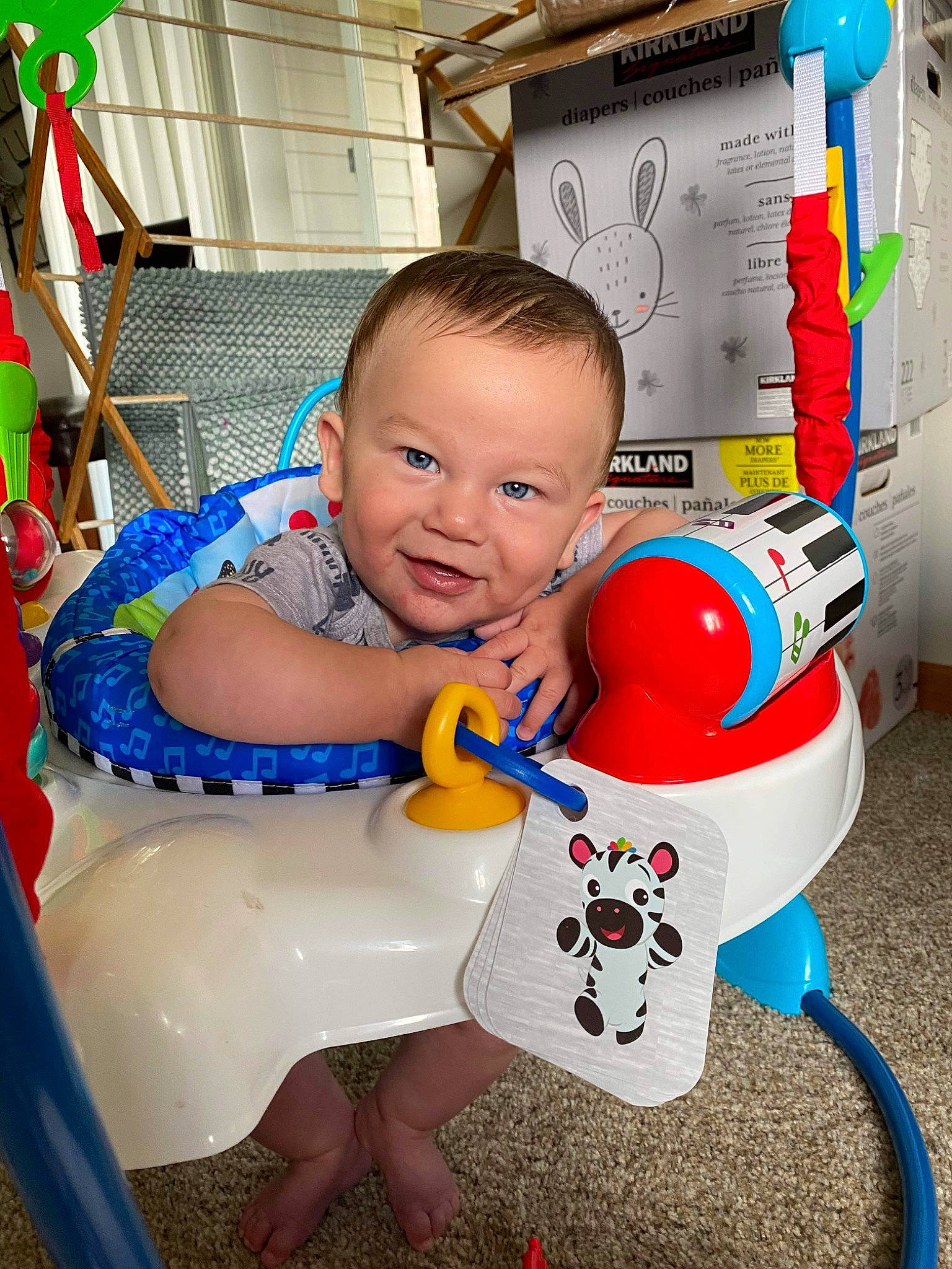 Colton is registered to the contest to win money with this photo: baby, baby_playing_with_toys, baby_products, baby_toddler_clothing, baby_toys, carmine, child, facial_expression, fun, happy, leisure, party_supply, person, plastic, play, red, sitting, smile, toddler, toy