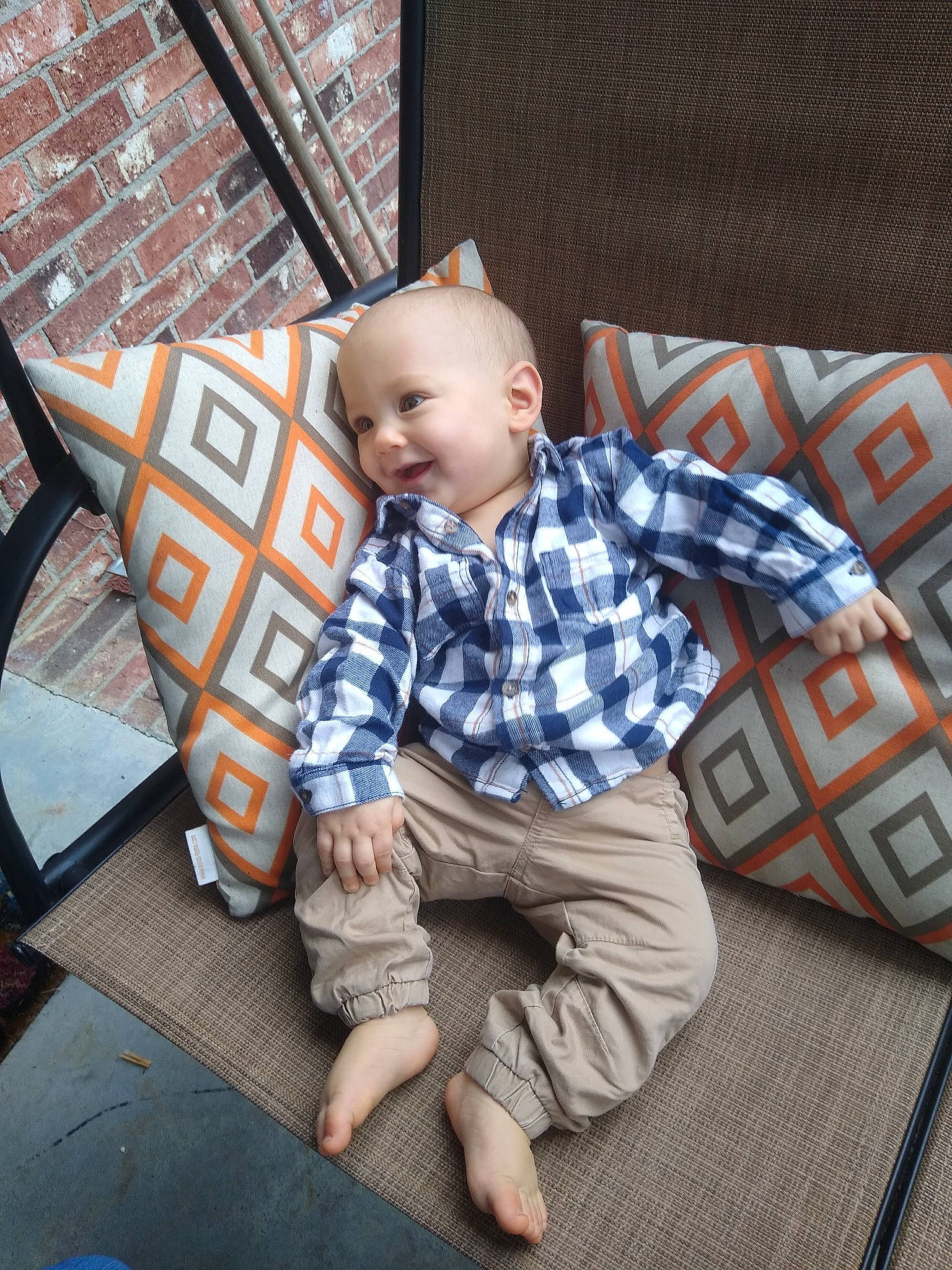 Salvatore is registered to the contest to win money with this photo: baby, child, couch, flooring, fun, leisure, linens, pattern, person, plaid, room, sitting, sleeve, t_shirt, tartan, toddler, vacation, wood