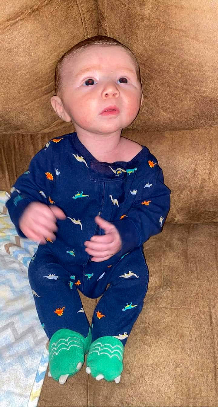 Brantlee is registered to the contest to win money with this photo: baby, baby_toddler_clothing, cheek, child, collar, eye, face, finger, head, iris, joint, nose, outerwear, person, product, skin, sleeve, standing, t_shirt, textile