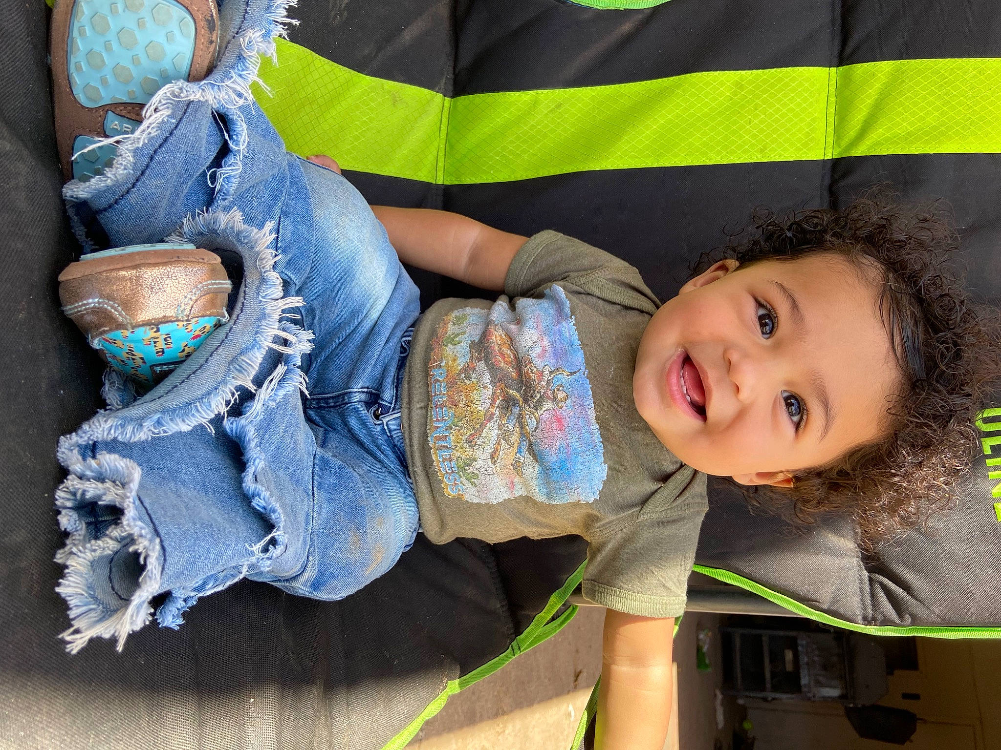 Cattleya is registered to the contest to win money with this photo: baby_toddler_clothing, child, comfort, denim, electric_blue, fun, grass, green, happy, head, human_leg, jeans, joy, leisure, pattern, person, skin, smile, t_shirt, thigh