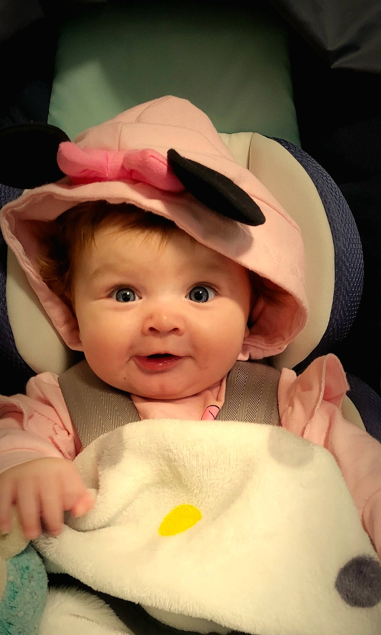 Chloe is registered to the contest to win money with this photo: baby, baby_toddler_clothing, cap, cheek, child, comfort, eyebrow, eyelash, fashion_accessory, finger, happy, hat, headgear, human_body, lip, nose, person, pink, skin, textile