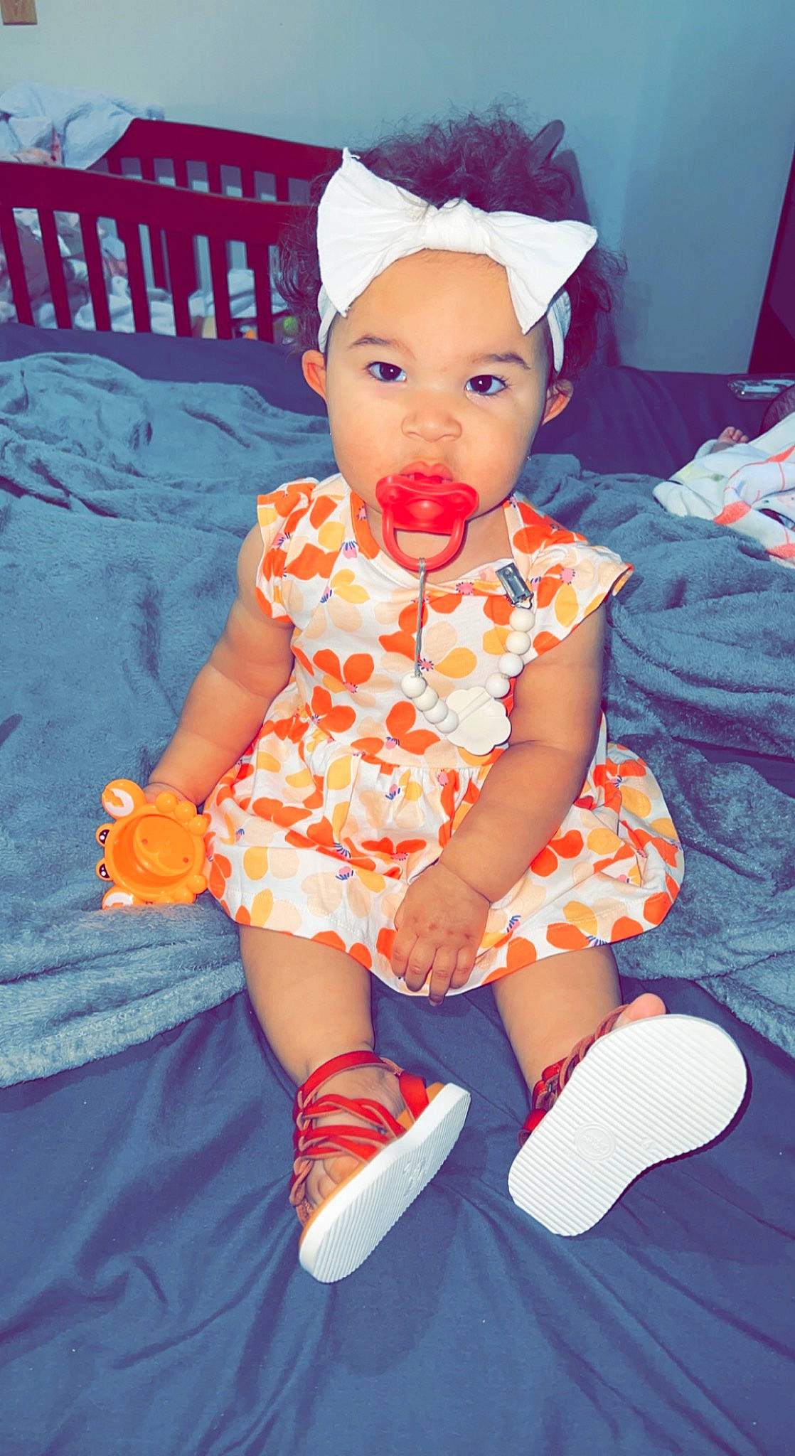 London joined the competition — help win amazing prizes! azure, baby, baby_toddler_clothing, child, electric_blue, face, finger, fun, happy, headwear, orange, pattern, person, pink, product, purple, red, sleeve, sock, textile