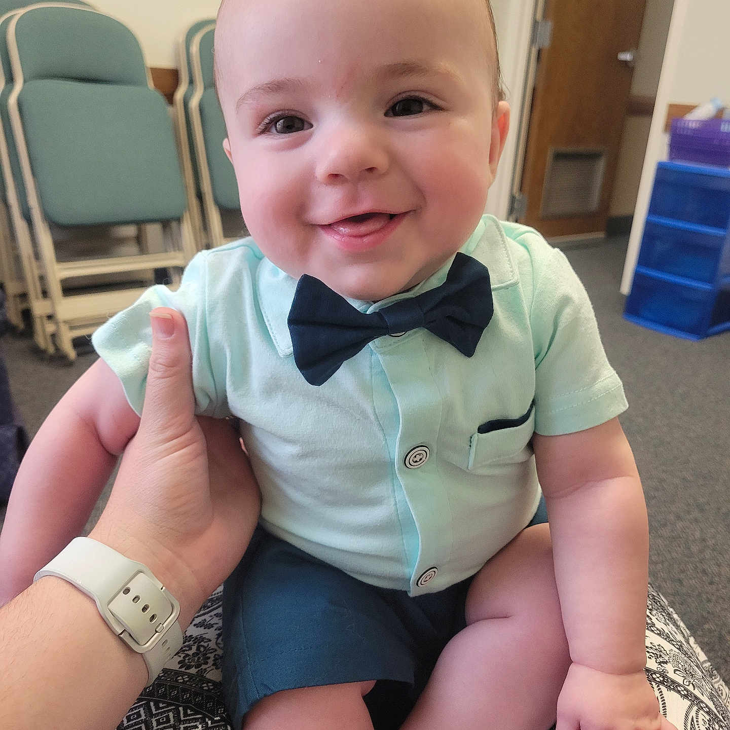 Andrew is registered to the contest to win money with this photo: accessories, art, baby, bodypart, clothing, couch, face, finger, formalwear, furniture, hand, head, painting, person, photography, portrait, shorts, sitting, tie, wristwatch