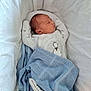 Leon joined the competition — help win amazing prizes! newborn, baby, sleeping, blanket, blue_blanket, white_cushion, crib, plush_toy, infant, cozy, peaceful, indoors, cute, child, soft_texture, resting, portrait, wearing_onesie, head, small_face