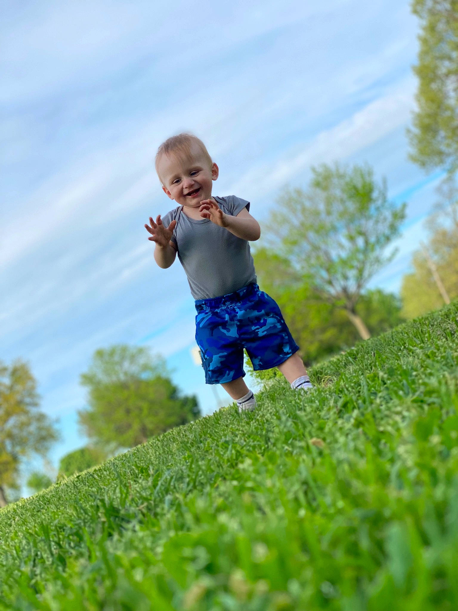Owen joined the competition — help win amazing prizes! cloud, face, fun, gesture, grass, grass_family, grassland, happy, joy, landscape, leisure, meadow, people_in_nature, person, plant, recreation, shorts, sky, sunlight, t_shirt