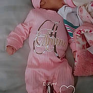 Amenna is registered to the contest to win money with this photo: baby, bottle, sleeping, pink_outfit, headband, bed, blanket, floral_booties, infant, cute, cozy, person, child, portrait, feeding, soft_lighting, indoors, resting, sleep, clothing