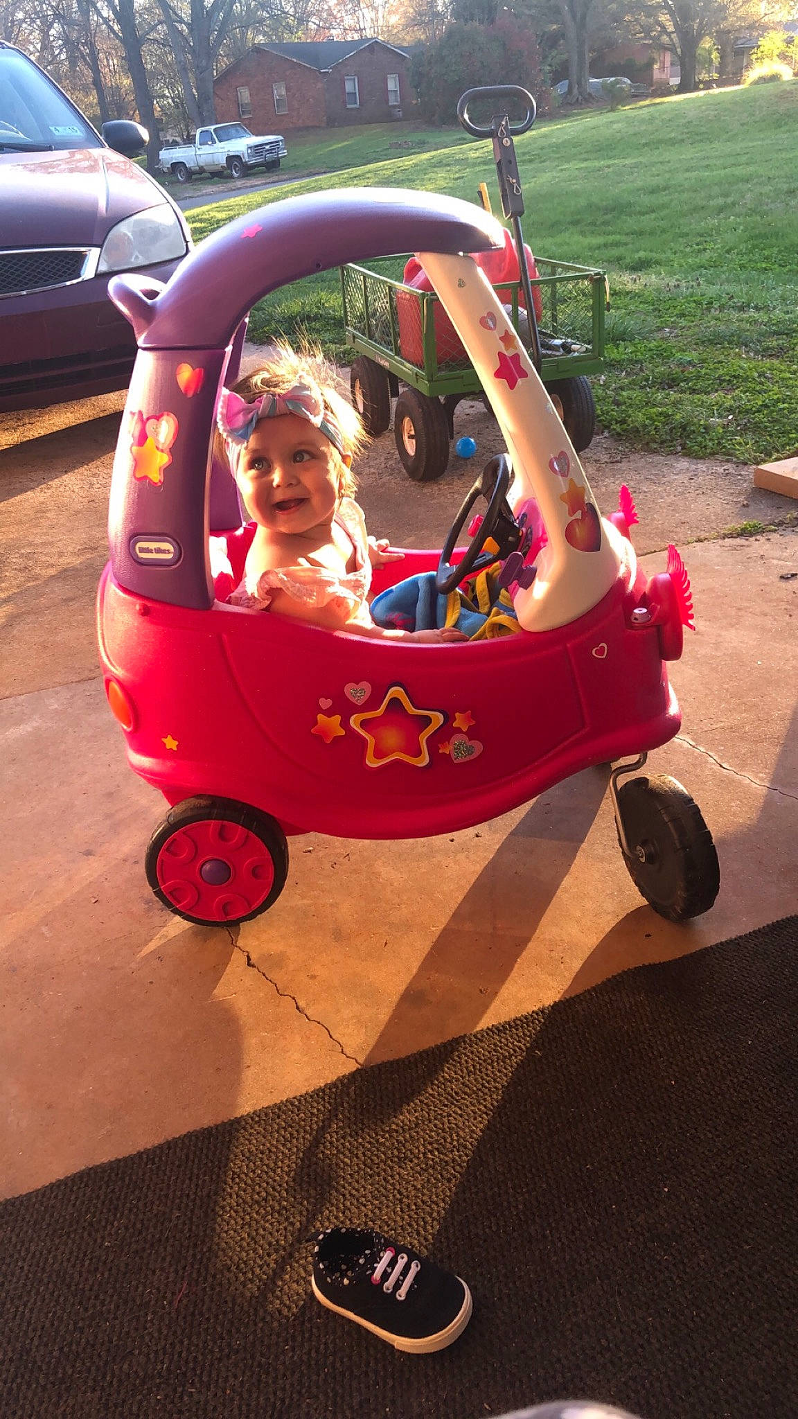 Ciana joined the competition — help win amazing prizes! automotive_exterior, baby, baby_carriage, baby_products, baby_toddler_clothing, car, cart, child, fun, grass, headwear, leisure, magenta, motor_vehicle, person, plant, riding_toy, sunglasses, tire, toddler