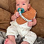 Carter Olin joined the competition — help win amazing prizes! baby, pacifier, bib, couch, blanket, infant, clothing, foot, hand, face, person, indoor, comfort, cute, relaxing, newborn, soft, beads, pattern, portrait