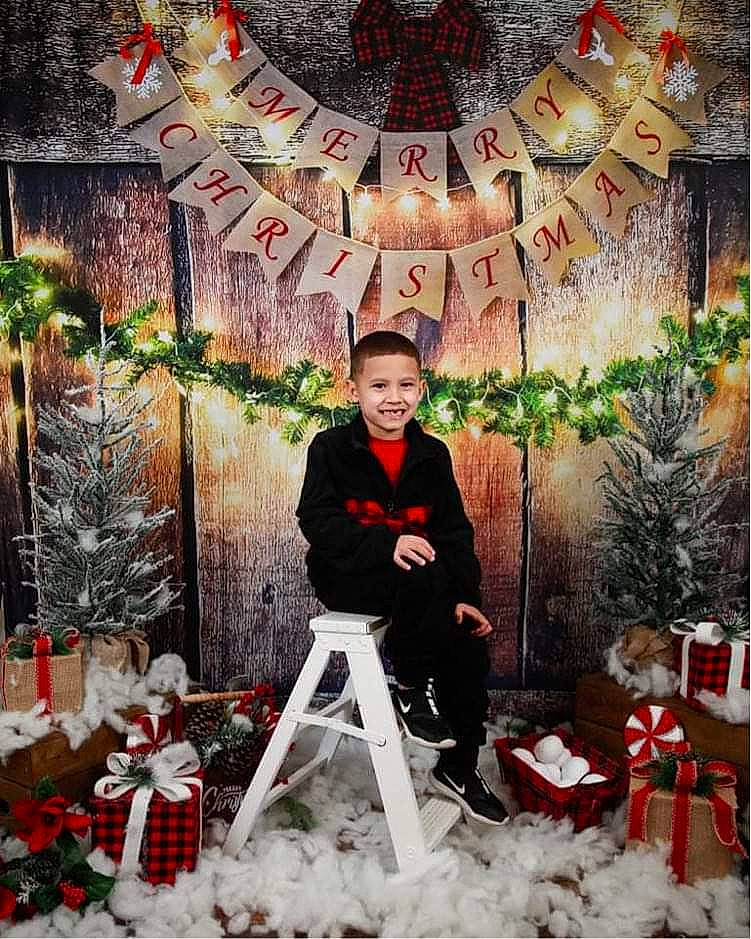 Blake is registered to the contest to win money with this photo: christmas, christmas_decoration, christmas_eve, christmas_ornament, christmas_tree, event, fun, happy, holiday, holiday_ornament, interior_design, joy, ornament, person, photograph, plant, red, snapshot, snow, tree