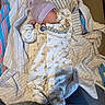 baby, newborn, sleeping, onesie, hat, blanket, pacifier, clip, infant, clothing, fabric, soft, cozy, lying_down, cute, peaceful, indoor, child, person, resting