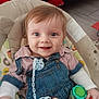 baby, infant, smiling, blue_eyes, denim_overalls, striped_shirt, pacifier, toy, baby_seat, cushion, indoor, floor, red_blanket, child, happy, person, clothing, cute, young, portrait