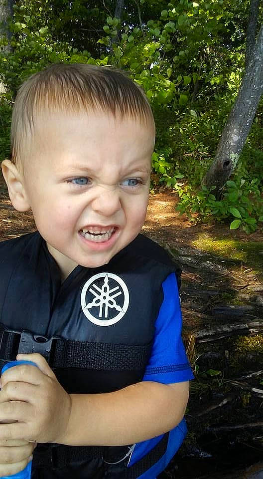 Kaison is registered to the contest to win money with this photo: anger, baby, baby_toddler_clothing, child, cool, electric_blue, fun, grass, happy, leisure, logo, people_in_nature, person, personal_protective_equipment, plant, portrait_photography, sitting, sleeve, smile, t_shirt