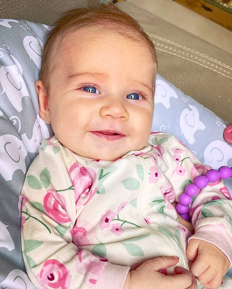 Maisie is registered to the contest to win money with this photo: baby, baby_toddler_clothing, cheek, chin, ear, eye, eyebrow, eyelash, face, facial_expression, head, human_body, iris, joy, lip, mouth, nose, person, product, skin