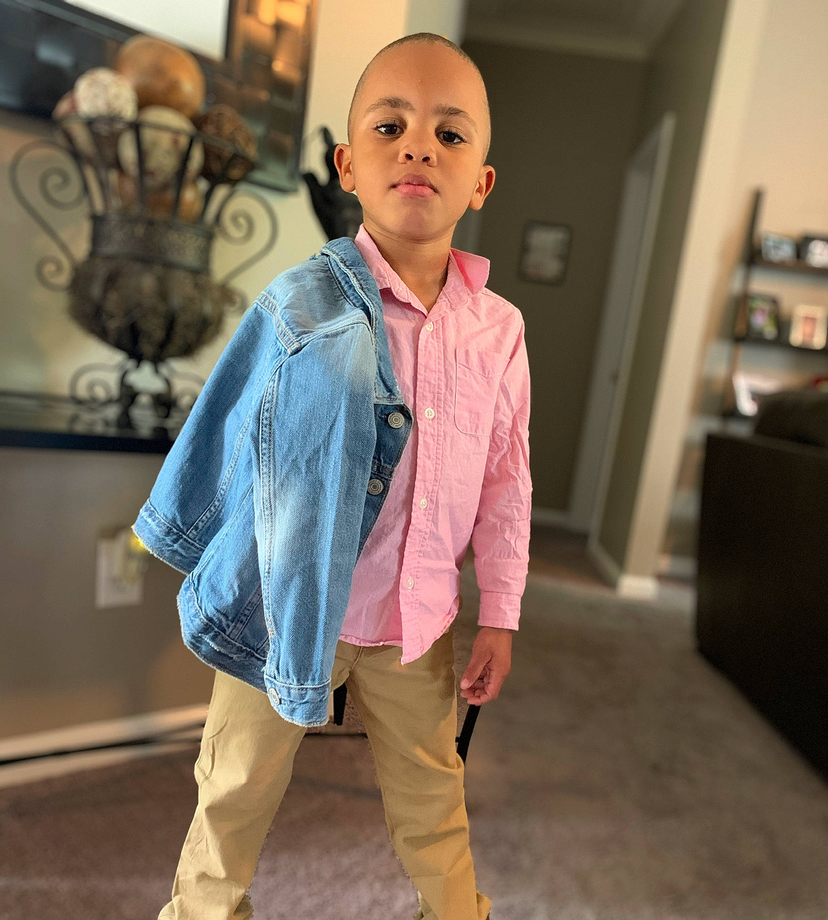 Landon is registered to the contest to win money with this photo: child, clothing, cool, denim, fashion, fashion_design, footwear, jacket, jeans, joint, neck, outerwear, person, pink, shoe, shoulder, sleeve, standing, street_fashion, t_shirt