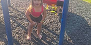 Ava joined the competition — help win amazing prizes! child, children, playground, slide, park, grass, sunlight, shadow, bench, adult, tree, outdoor, summer, play, barefoot, shorts, pink_top, red_slide, fun, daytime