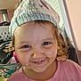 Violet joined the competition — help win amazing prizes! child, smiling, face, hat, knitted_hat, messy_face, indoor, clothing, pink_shirt, young_child, person, portrait, cute, happy, brown_eyes, hair, closeup, expression, home, cozy
