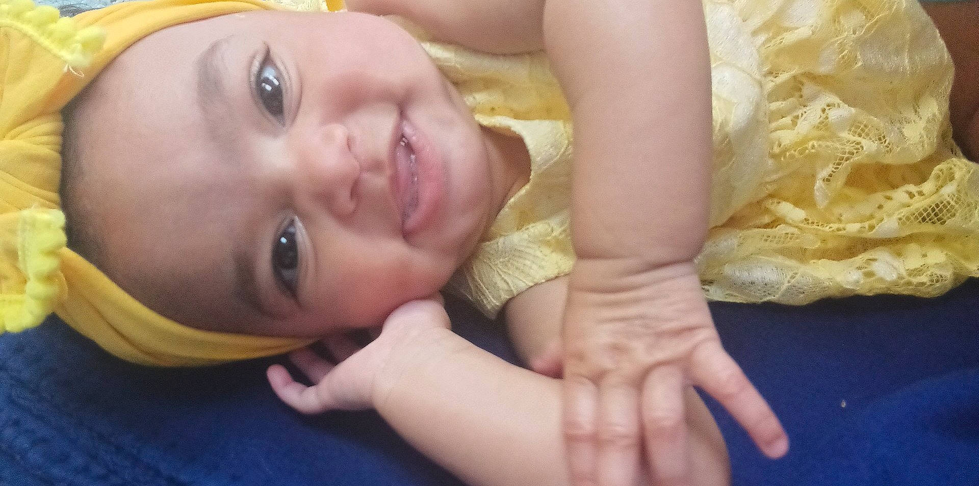 Dezire is registered to the contest to win money with this photo: chest, child, comfort, dress, eyelash, finger, gesture, grass, happy, human_body, joy, leg, lip, nail, nose, person, skin, smile, thumb, toddler