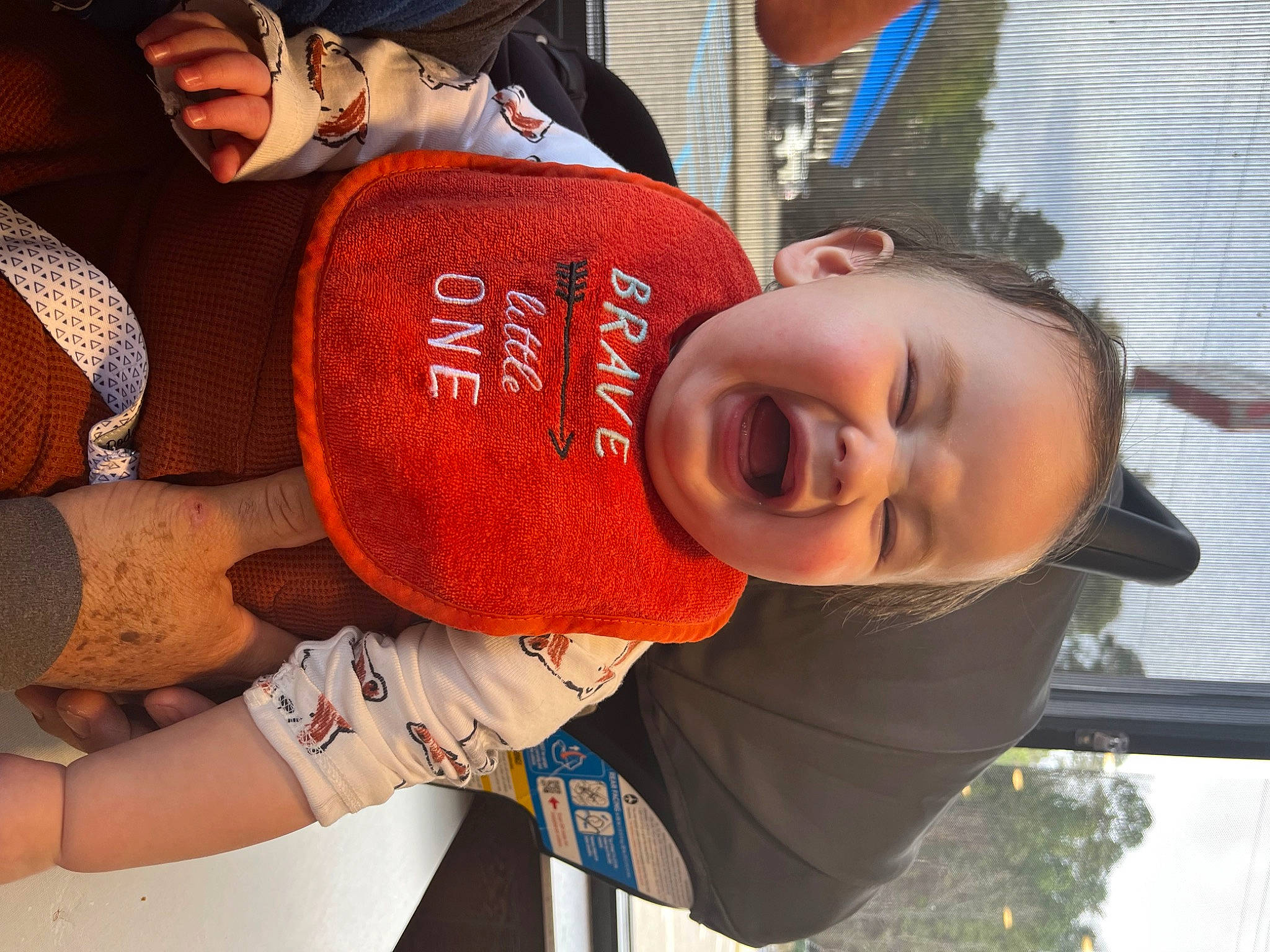 Ian is registered to the contest to win money with this photo: baseball_cap, cap, carmine, child, cool, elbow, eyewear, fashion_accessory, fun, happy, hat, human_leg, leisure, mouth, pattern, person, personal_protective_equipment, thigh, toddler, tree