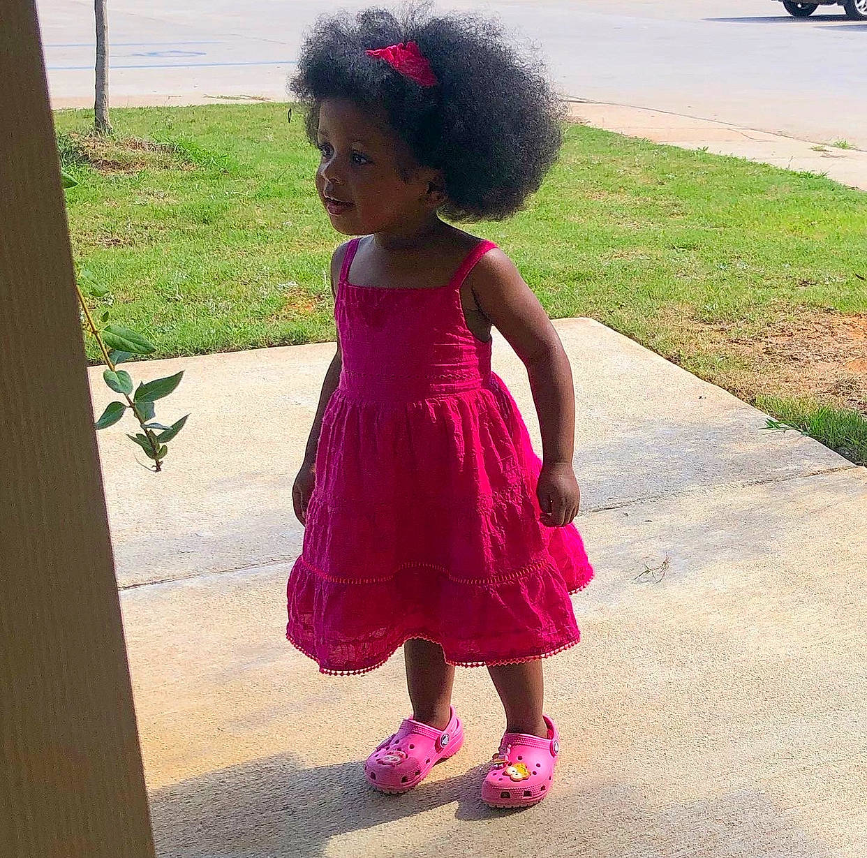 Mya joined the competition — help win amazing prizes! afro, baby_toddler_clothing, child, day_dress, dress, footwear, fun, grass, hair, hairstyle, head, human_body, leg, magenta, pattern, person, pink, plant, purple, toddler