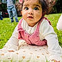 baby, child, crawling, cute, daylight, flower, fun, grass, greenery, headband, nature, outdoor, park, people, pillow, pink_clothing, playing, portrait, white_sweater, young_boy