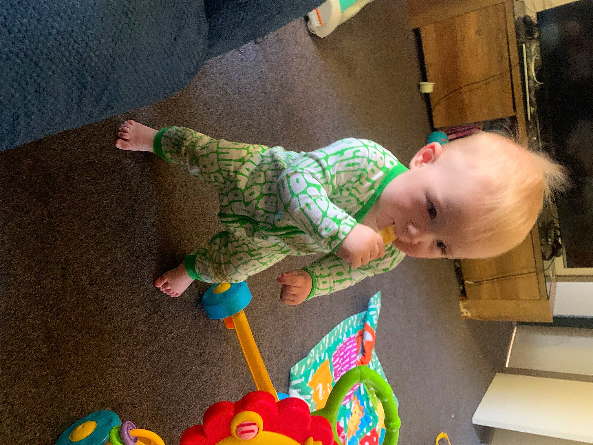 Dean is registered to the contest to win money with this photo: baby, baby_playing_with_toys, baby_products, baby_toddler_clothing, baby_toys, child, comfort, flooring, fun, hardwood, holiday, person, play, product, room, sitting, sock, stuffed_toy, toddler, toy