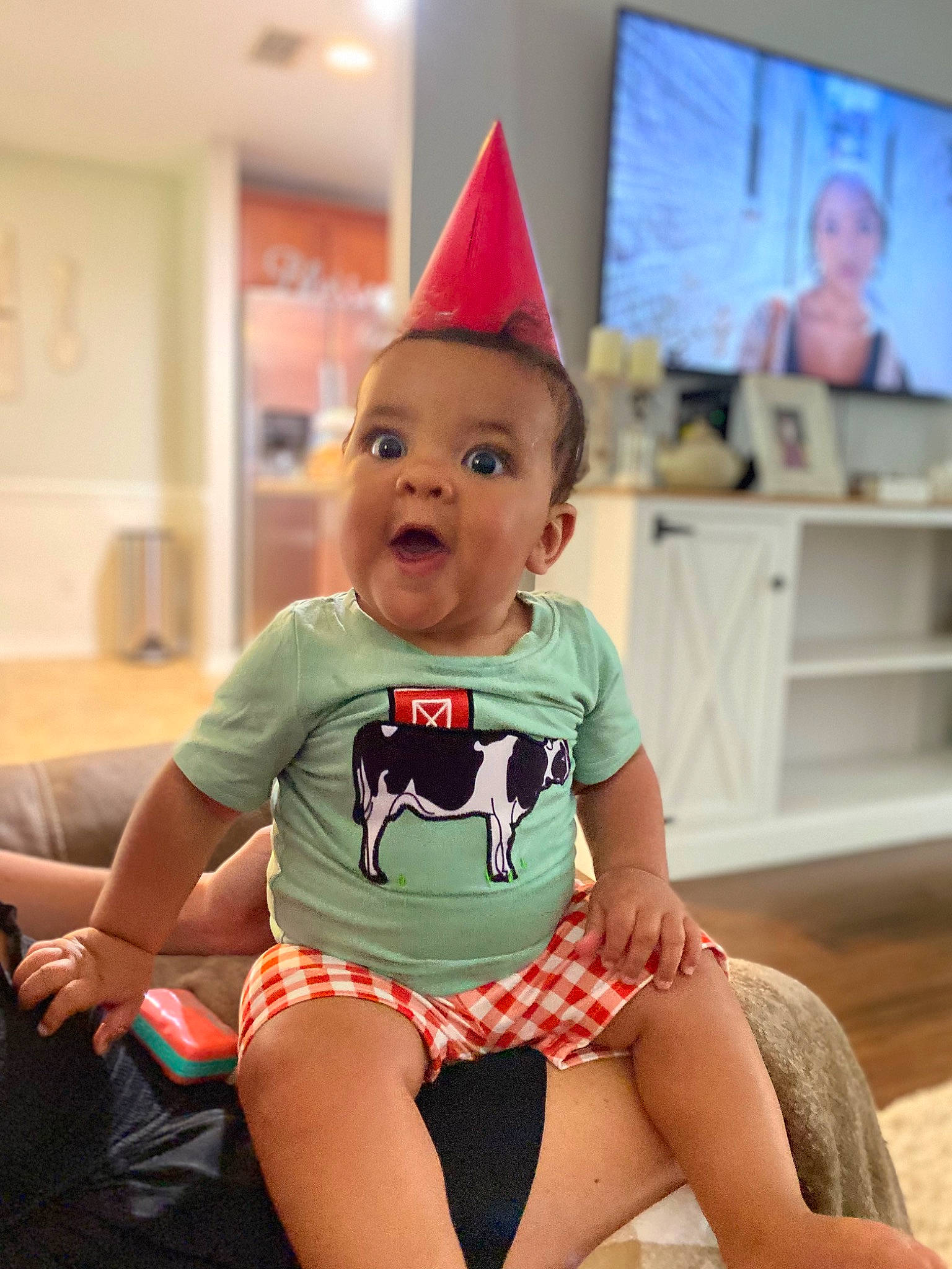 Karson joined the competition — help win amazing prizes! birthday, child, cone, costume_hat, event, fashion_accessory, fun, happy, headgear, holiday, human_leg, knee, lap, party_hat, party_supply, person, pink, sitting, surprise, television