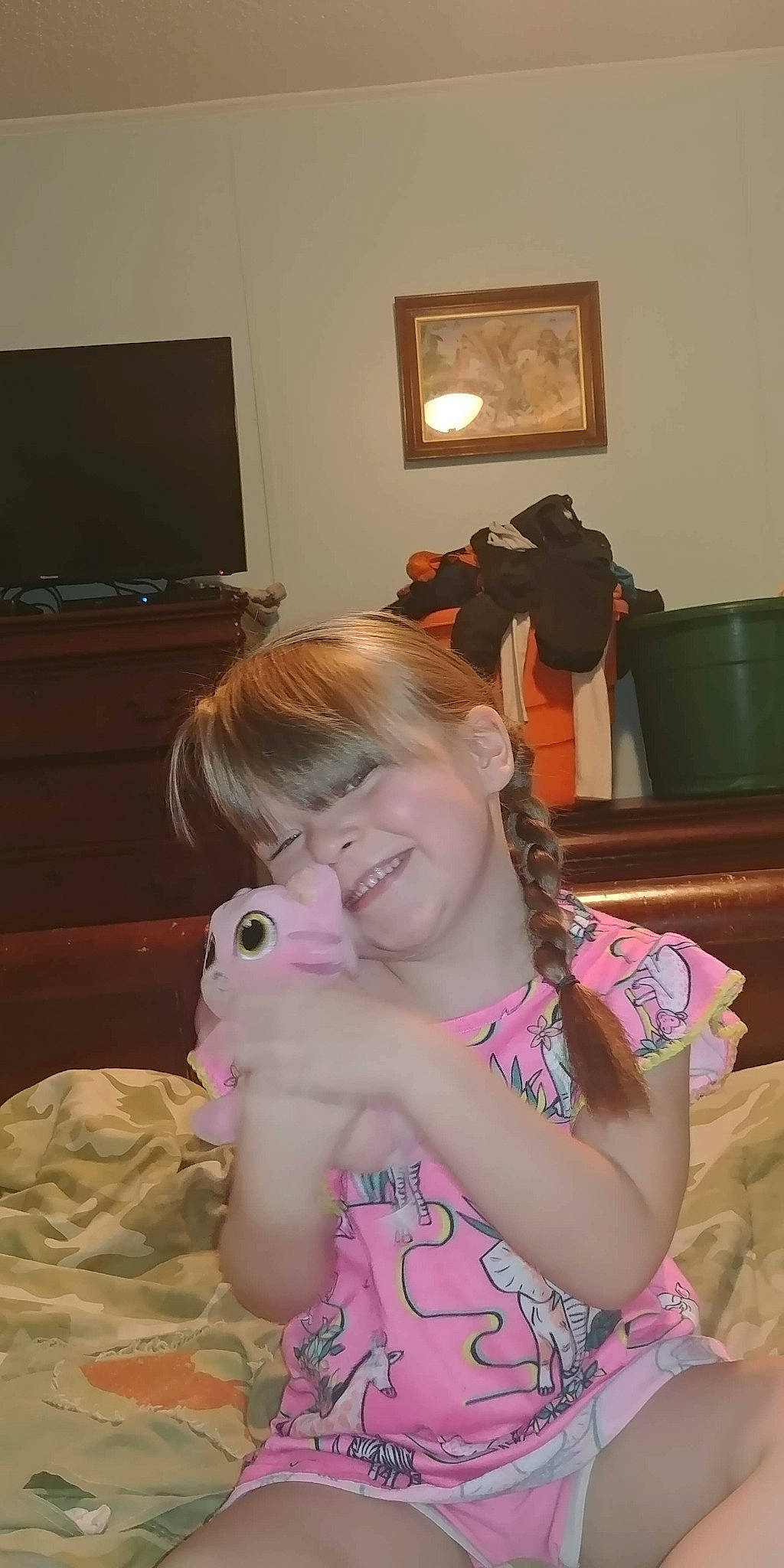 Vicki Lynn is registered to the contest to win money with this photo: child, comfort, ear, eye, flooring, fun, happy, head, home_appliance, joy, linens, living_room, person, picture_frame, room, sitting, skin, smile, t_shirt, television