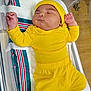 baby, bassinet, blanket, child, cute, headwear, hospital, human, indoors, infant, newborn, peaceful, person, resting, sleeping, small, sock, soft, toddler, yellow_clothing