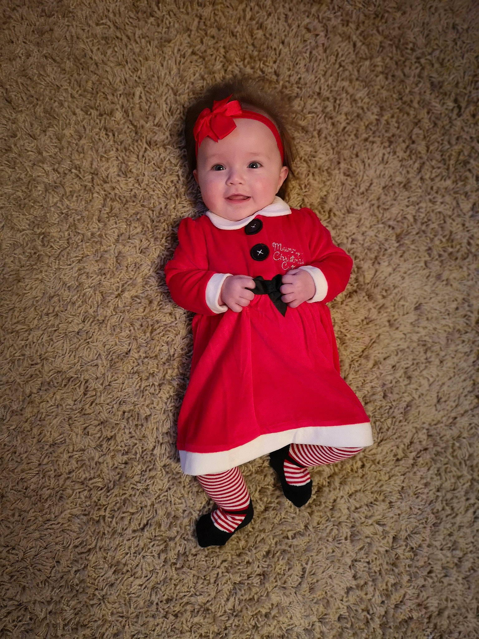 Aria is registered to the contest to win money with this photo: child, costume, fun, girl, infant, outerwear, person, pink, red, skin, smile, textile, toddler