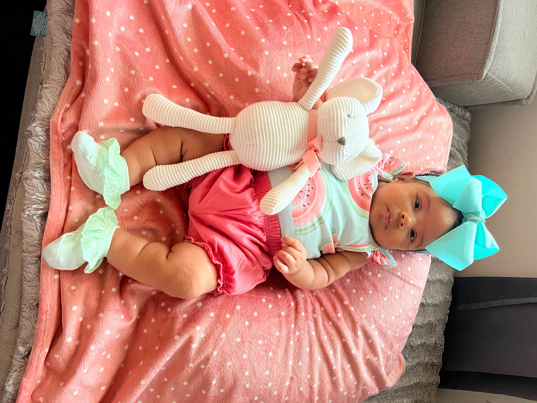 Mikayla is registered to the contest to win money with this photo: baby, baby_products, baby_sleeping, baby_toddler_clothing, bedding, child, comfort, couch, event, head, linens, magenta, pattern, peach, person, pink, product, room, skin, textile