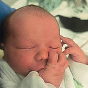 Maël participe au concours pour gagner de l'argent avec cette photo : newborn, baby, sleeping, thumb_sucking, blanket, soft, infant, closeup, face, hand, cute, peaceful, wrapped, newborn_clothing, indoors, portrait, resting, skin, child, baby_garment
