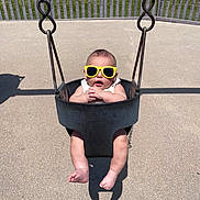 Koda Blu joined the competition — help win amazing prizes! baby, bucket_swing, child, concrete, cool, cute, feet, fun, grass, infant, legs, metal_chain, outdoor, park, playground, shadow, summer, sunglasses, sunny, swing