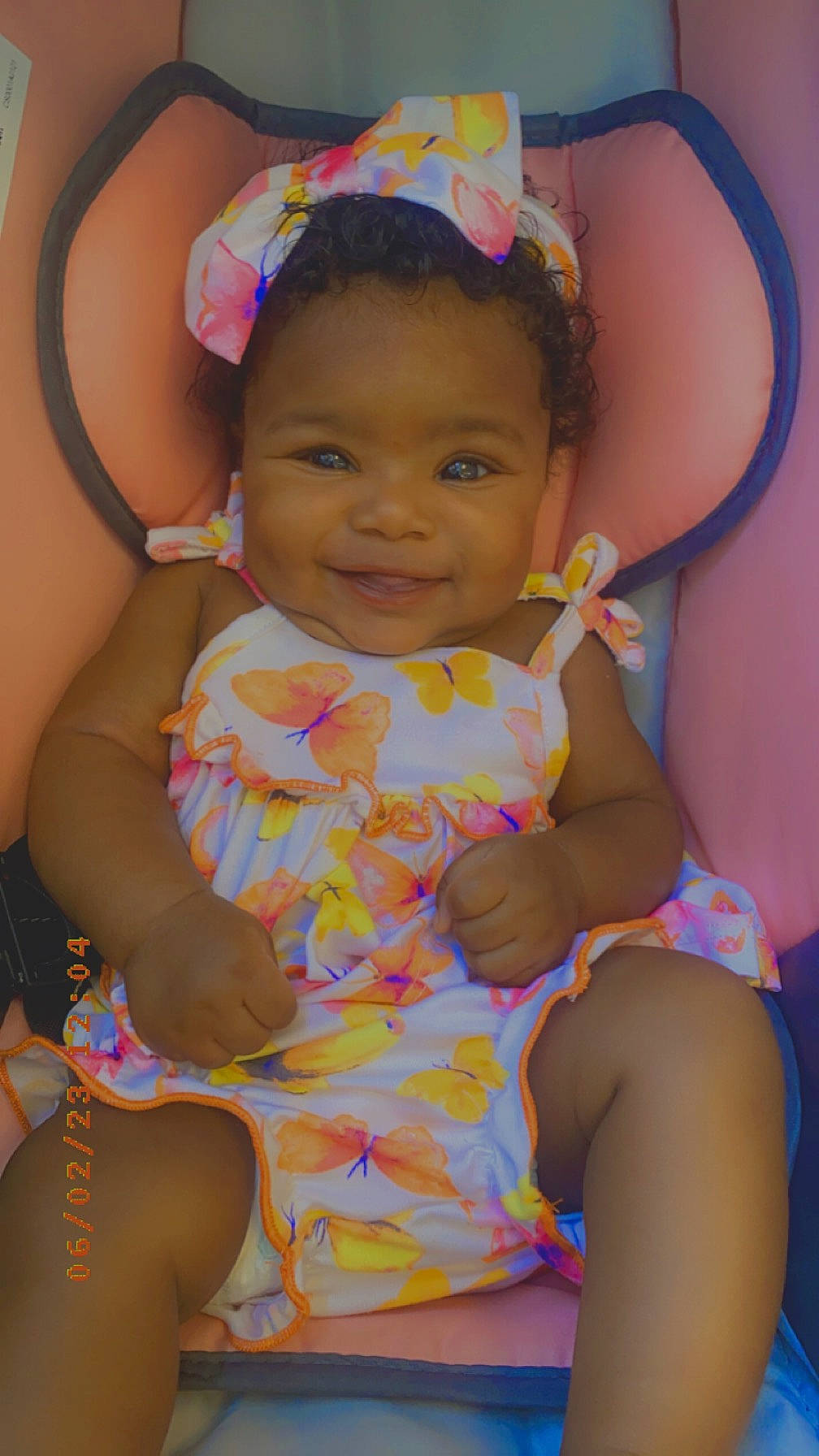 Lariyah is registered to the contest to win money with this photo: baby_toddler_clothing, cheek, child, eye, face, facial_expression, finger, fun, hairstyle, happy, head, headgear, human_body, joy, mouth, organ, person, pink, purple, skin