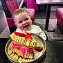 baby, child, high_chair, waffle, ice_cream, strawberry, dessert, plate, table, diner, pink_chair, smiling, happy, food, indoor, person, sweet, cream, drizzle, seat