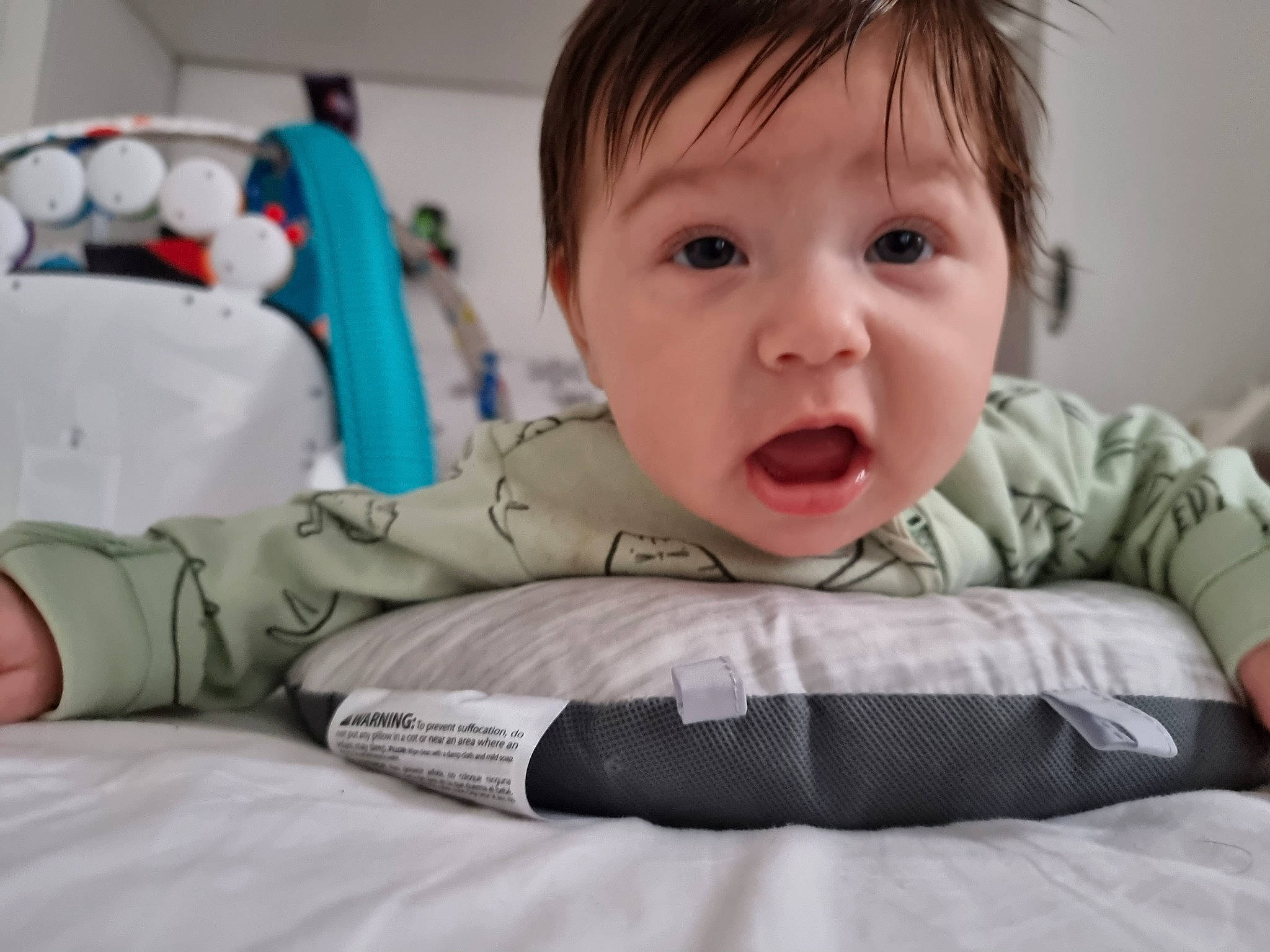 Alexia is registered to the contest to win money with this photo: baby, baby_products, baby_toddler_clothing, cheek, child, comfort, eyelash, fun, happy, linens, mouth, neck, nose, person, room, sitting, skin, sleeve, smile, surprise