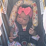 Nyla joined the competition — help win amazing prizes! baby, car_seat, headband, pink_bow, floral_pattern, safety_harness, mesh_cover, infant, child, colorful_clothing, seat_belt, cute, indoor, portrait, baby_clothes, sitting, small_hands, head_support, child_safety, young_child